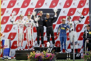 Armaan Ebrahim, along with  teammate, on podium after finishing third. A Meco Motorsports photo.