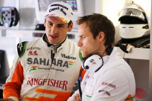 File photo of Adrian Sutil with an Engineer. Photo by Sahara Force India F1 team
