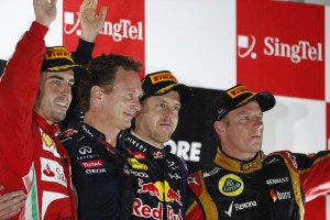 Alonso (left), Vettel (2nd from right) and Raikkonen (right) on the podium after the Singapore GP on Sunday. An FIA photo