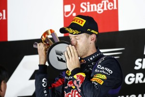 Vettel kisses the trophy after the Singapore win. An FIA photo