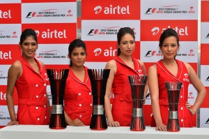 Airtel grid girls pose with the new trophies at a presentation on Friday at the Buddh International Circuit. A BIC photo