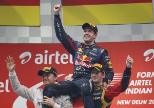 Nico Rosberg of Mercedes AMG Petronas (left) and Romain Grosjean of Lotus lift Sebastian Vettel of Red Bull as he clinches his fourth World Driver's title at BIC on Sunday. Photo by Mercedes AMG Petronas F1 team