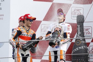 Marc Marquez celebrates on the podium in Valencia after becoming the youngest world champion. A Repsol Honda MotoGP team photo
