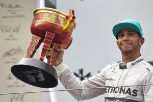 Hamilton with the cup after winning the Chinese GP. A Mercedes AMG Petronas image