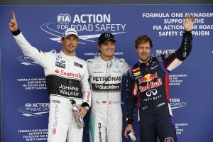 Nico Rosberg takes pole and is flanked by Jenson Button on his right and Sebastian Vettel at Silverstone on Saturday. An FIA image
