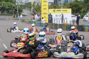 Vishnu Prasad (No. 66) and Nayan Chatterjee (No. 72) in action in the second heat of the Senior Max Category in the JK Tyre-FMSCI National Rotax Max Karting Championship 2014 at the Airport Track, Hyderabad on Saturday. Image by Vivek Phadnis