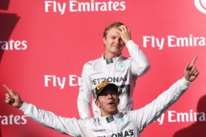 The Victor and the Vanquished: Hamilton celebrated after extending the championship lead while Nico Rosberg (background) ponders in Austin on Sunday. A Mercedes AMG Petronas team image