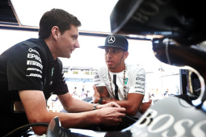 Hamilton seen with a team personnel before taking pole on Saturday at Monaco. A Mercedes AMG Petronas image