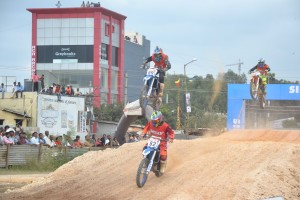 Aravind KP, Tanweer A W & Jinan CD in an intense battle for the lead in the MRF Supercross Nationals in Bangalore on Saturday. An MRF image