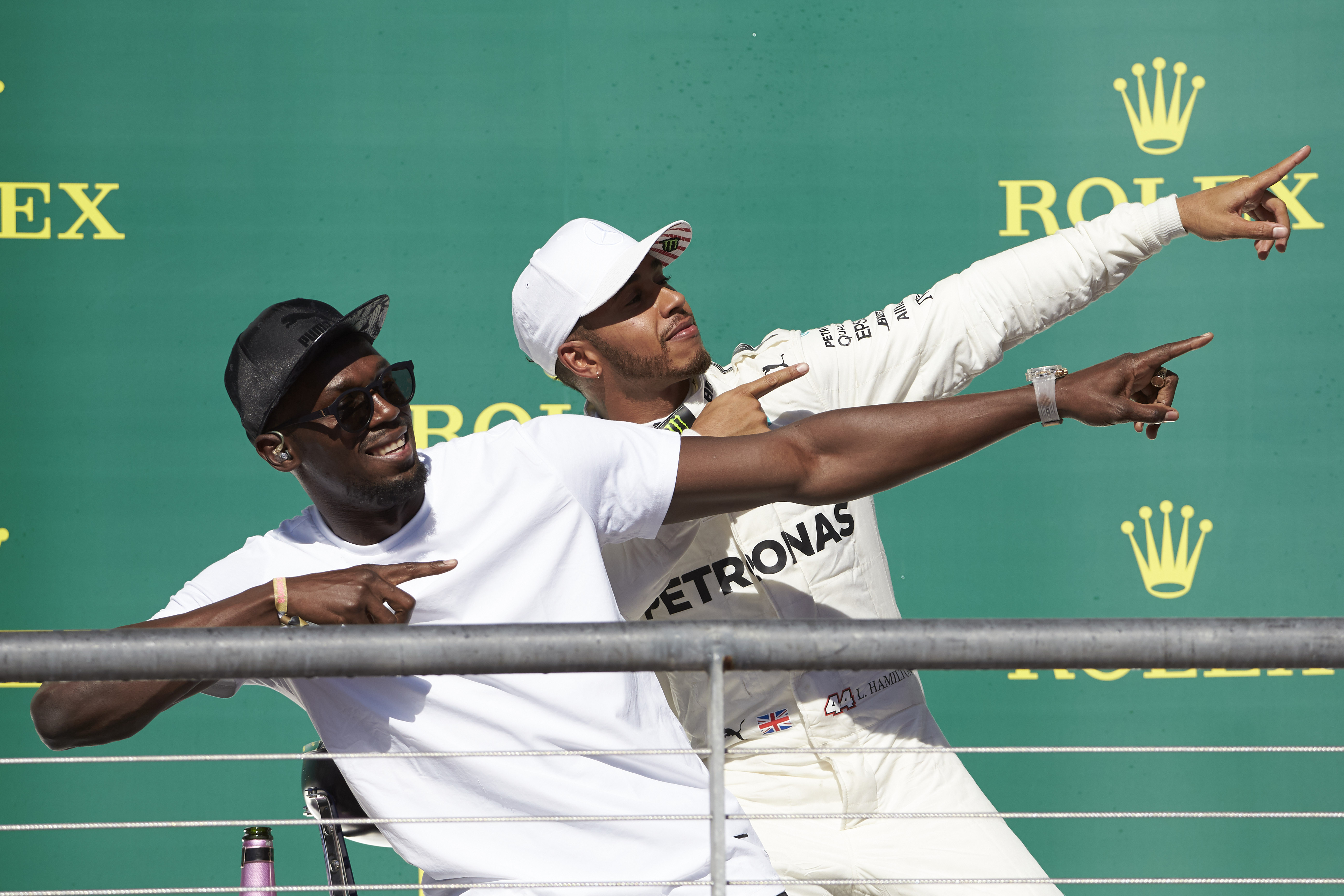Photo of Hamilton does a `Lightening Bolt’ celebration on the podium: 2 sporting legends meet
