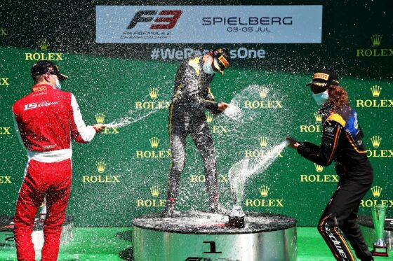 From left: Sargeant, Piastri and Peroni  as they spray champagne to celebrate on the podium. An FIA F3 image
